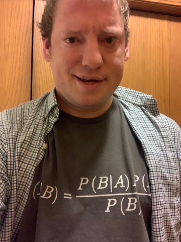 Me wearing a shirt with Bayes' theorem last year.